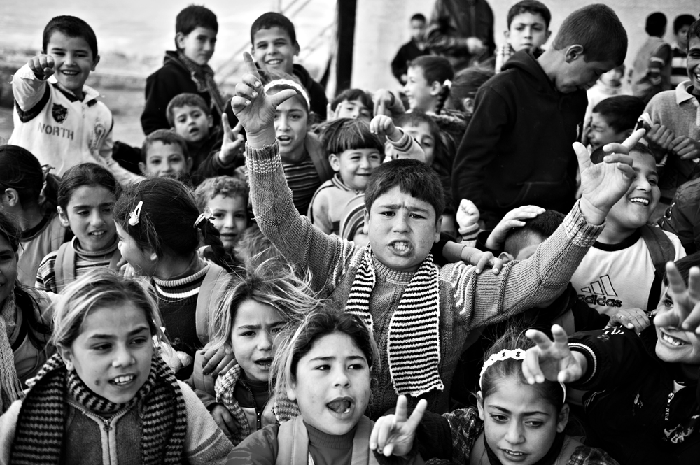 Group of kids singing that song -Photo full of different emotions describing complite song.