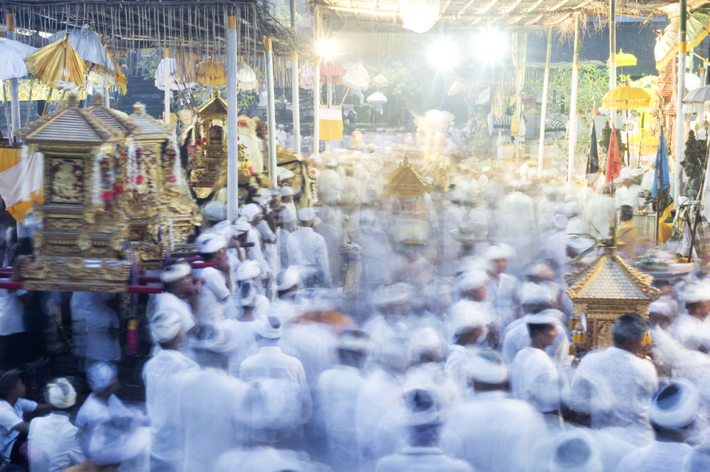 People taking part in Hindu ceremony at the temple in Ubud city