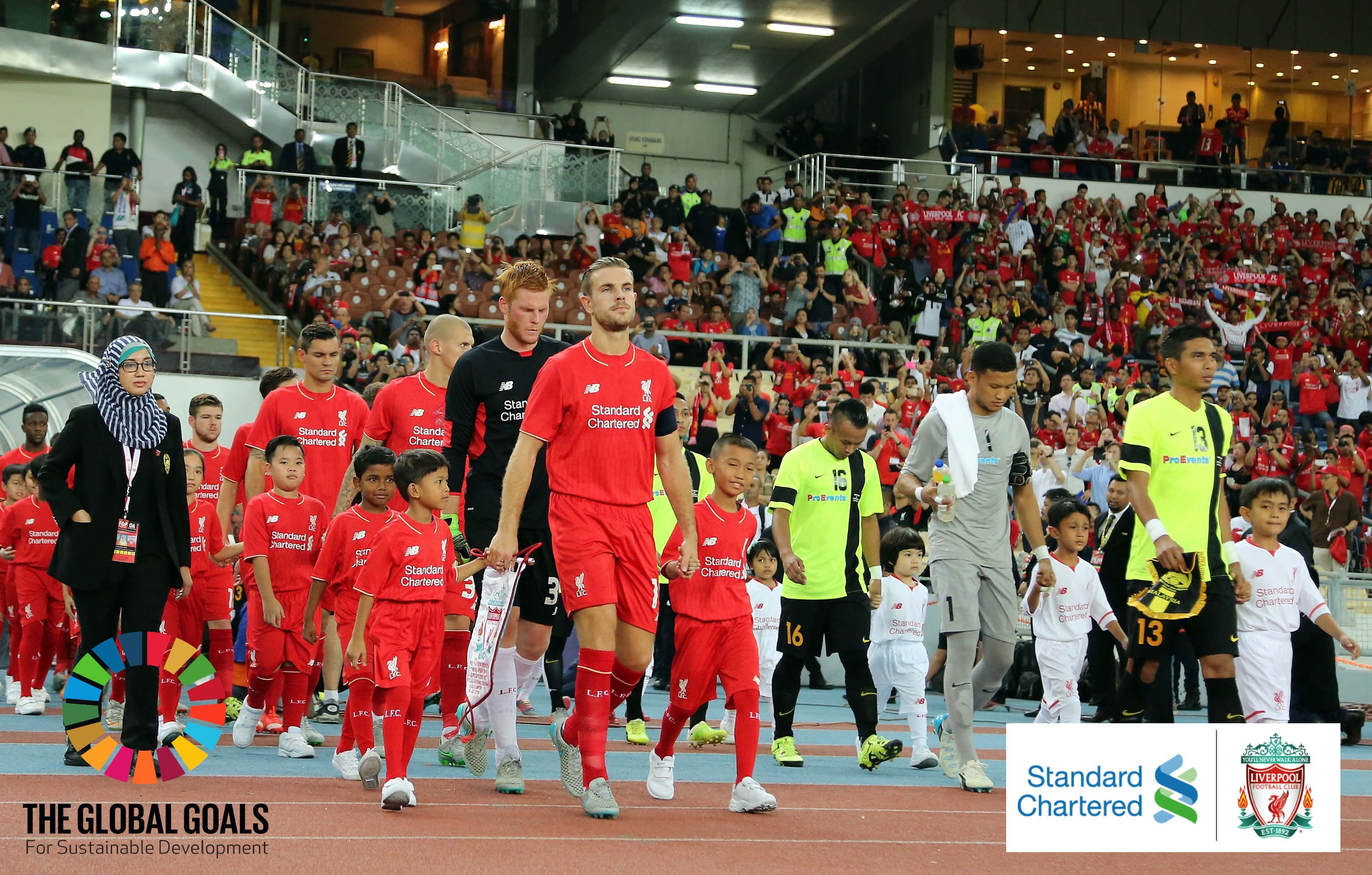 KUALA LUMPUR, MALAYSIA - JULY 24: (THE SUN OUT, THE SUN ON SUNDAY OUT) Liverpool and Malaysia XI enter the fileld prior to kick off of the international friendly match between Malaysia XI and Liverpool FC at Bukit Jalil National Stadium on July 24, 2015 in Kuala Lumpur, Malaysia. (Photo by Stanley Chou/LFC/Liverpool FC via Getty Images)